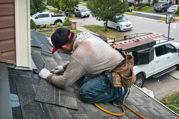 Professional Roofing technician working in North Rose, NY